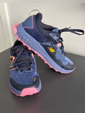 Woman’s New Balance Navy Blue, Pink & Yellow Trail Sneakers